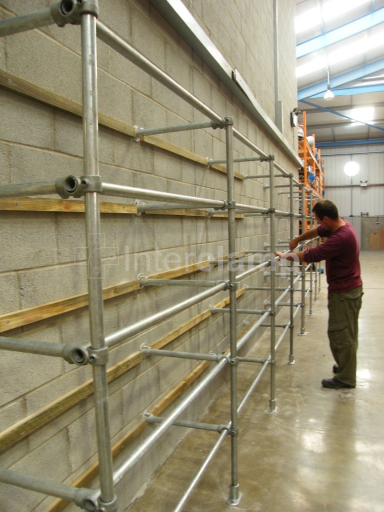 Close-up of Interclamp tube clamp fittings creating adaptable warehouse storage solutions, illustrating their flexibility in building racking and shelving tailored to exact specifications